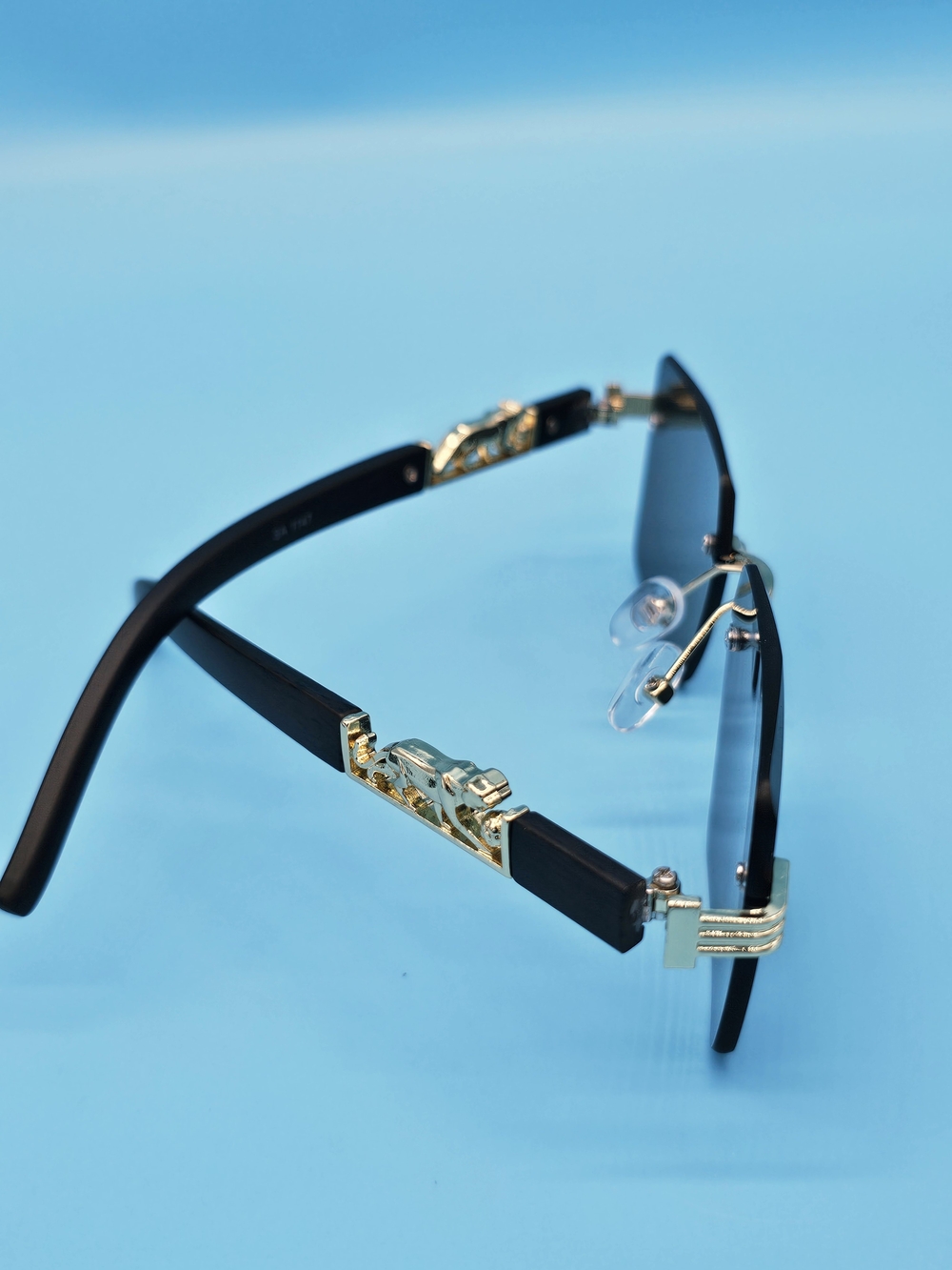 Men's Black and Gold Rimless Sunglasses